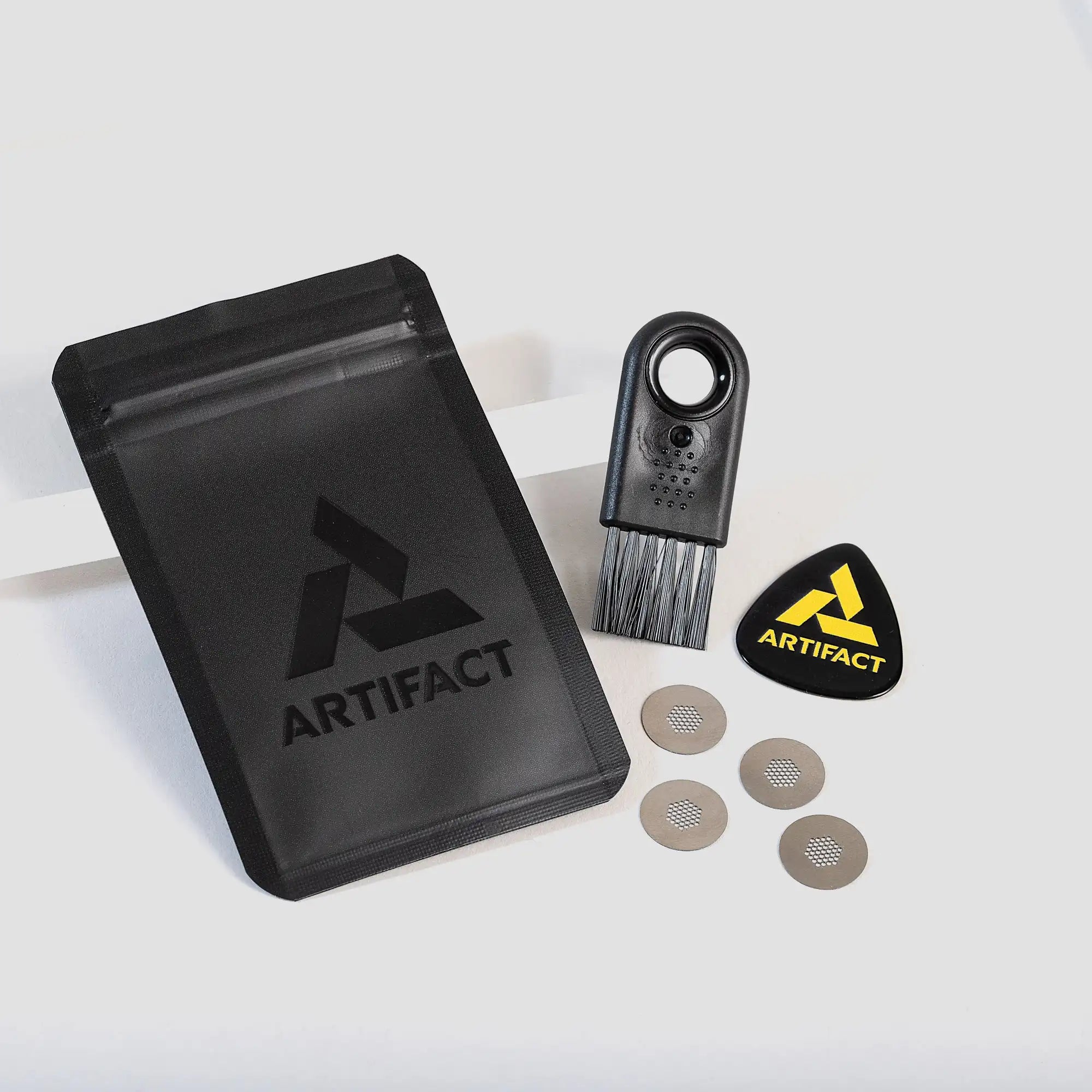 Official Tempest Tools kit featuring branded heavy duty ziplock baggie with Labyrinth cleaning brush, official Artifact branded bowl pick, and four pure-titanium screen filters.